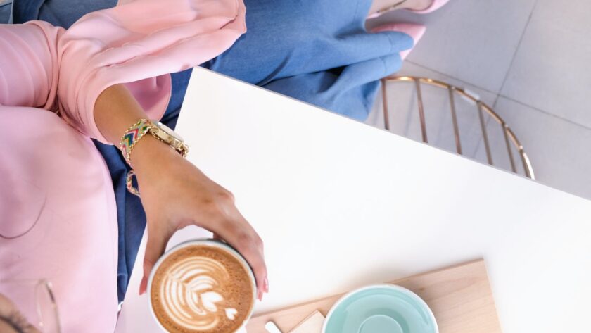 woman holding mug with coffee sitting at desk, business casual outfit ideas, business casual spring 2023, business casual outfit black girl